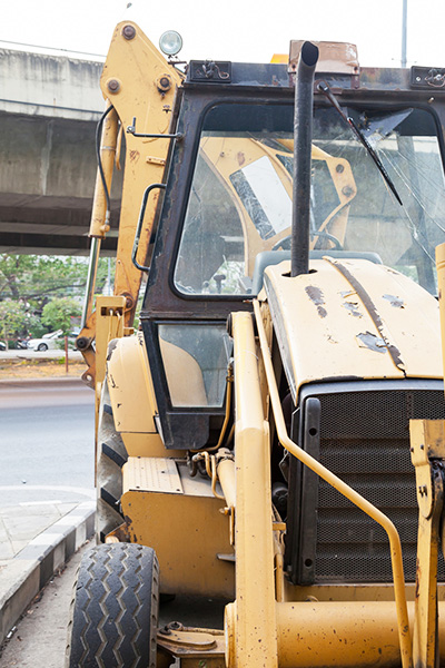 Backhoes are often used in commercial and residential reconstruction.