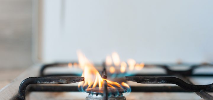 Burning gas in the kitchen. Horizontal photo with space for writing text.