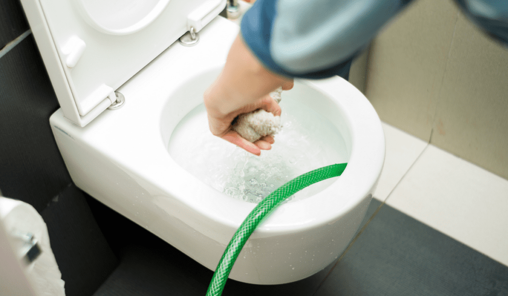 How do homeowners safely clean the toilet overflow How do homeowners safely clean the toilet overflow