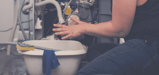 Woman tries to repair dishwasher leak