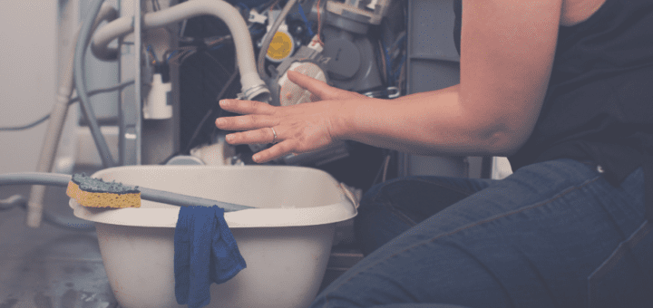 Woman tries to repair dishwasher leak