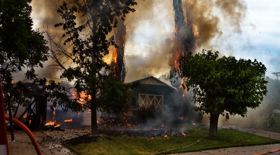 charred house from fire damage in a neighborhood