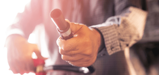 man showing fire extinguisher nozzle